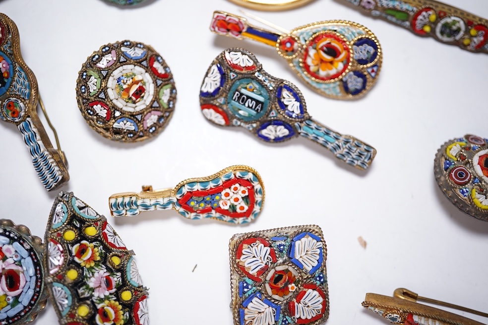 A collection of twenty-eight micro-mosaic brooches, including ten banjo and guitars shaped brooches, six similar large oval brooches, nine small brooches and three long brooches. (28) Condition - good